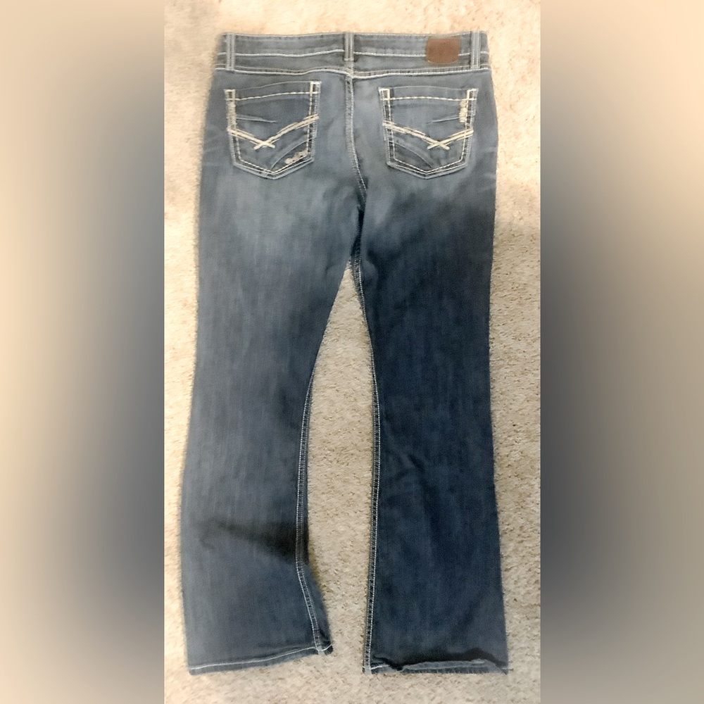 BKE Women’s mid-rise, boot cut jean.
